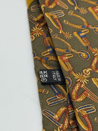 Dark green silk tie whit spurs pattern
