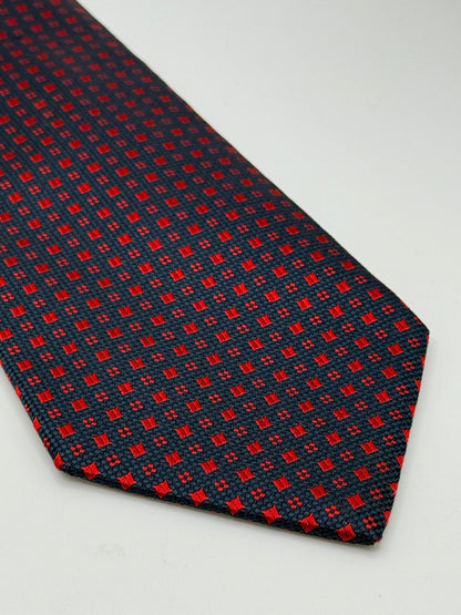 Dark blue jacquard silk tie whit small geometric pattern