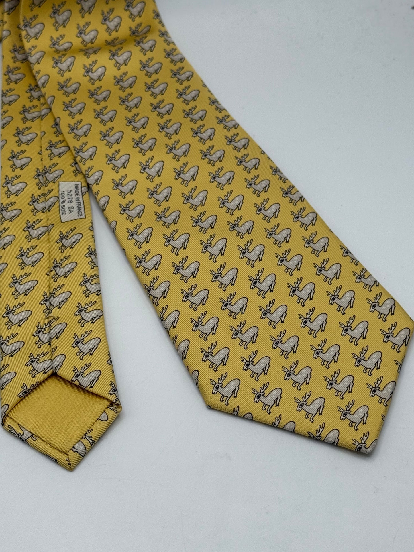Yellow twill silk tie whit small deer pattern